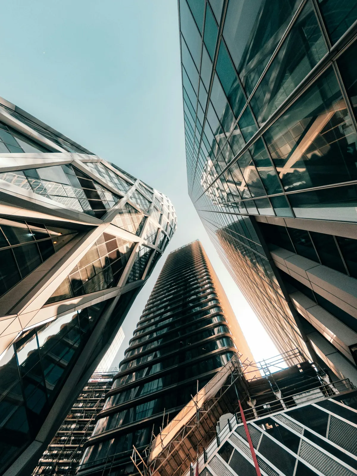 Glass towers seen from street level, looking up