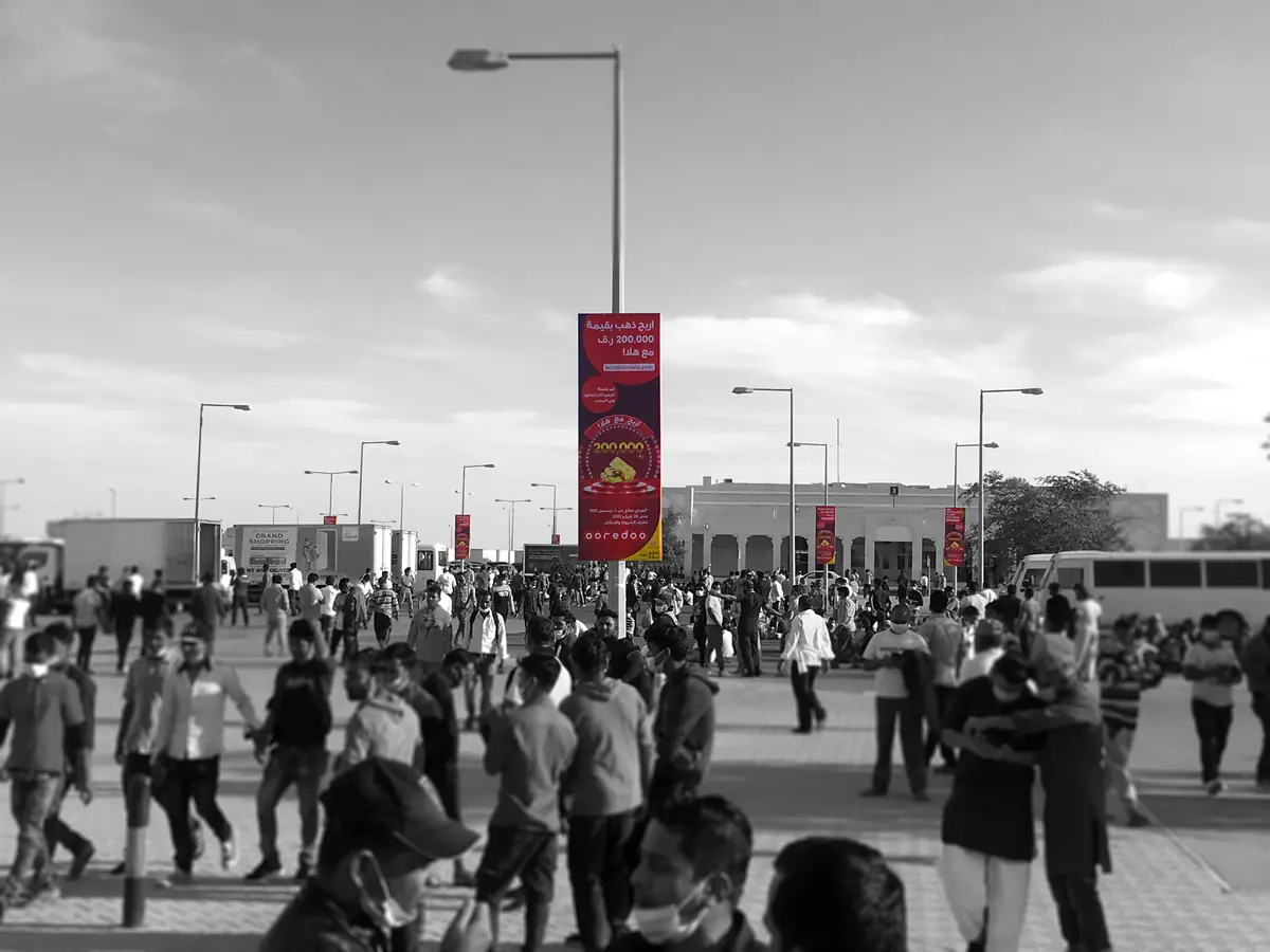 Lamppost banners along a busy Asian Town walkway