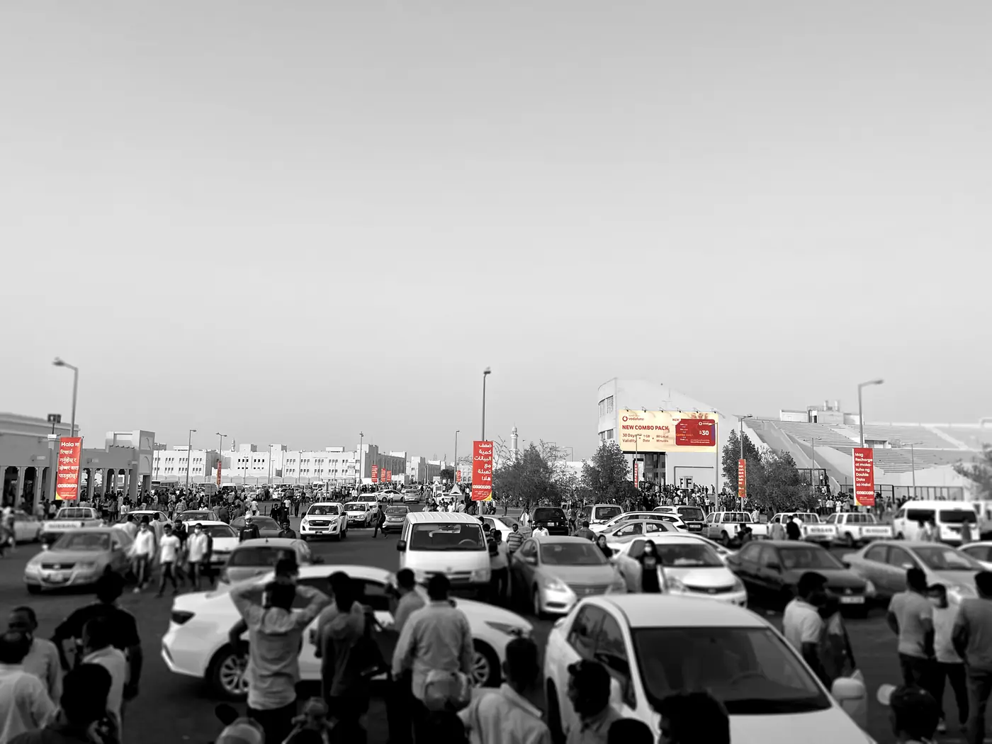 Lamppost banners across the Asian Town car park