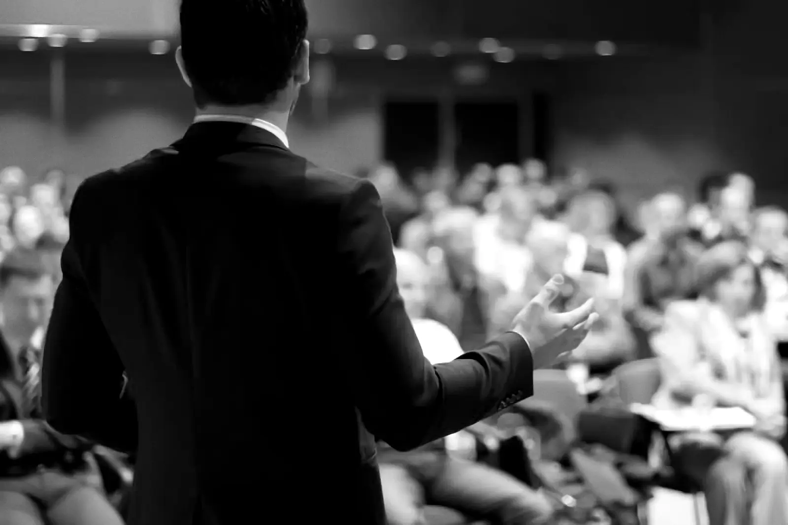 Speaker addressing a large audience